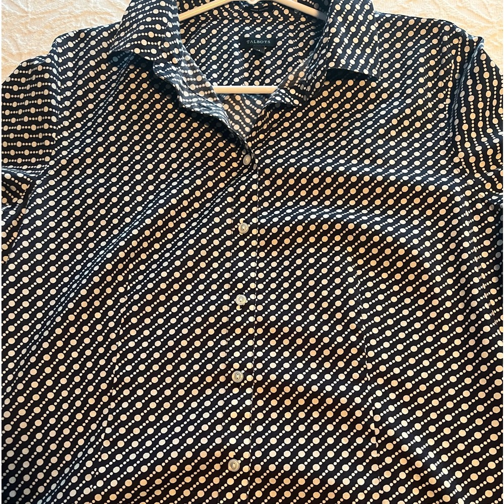 A Talbots Wrinkle Resistant Navy and White Polka Dot Blouse.